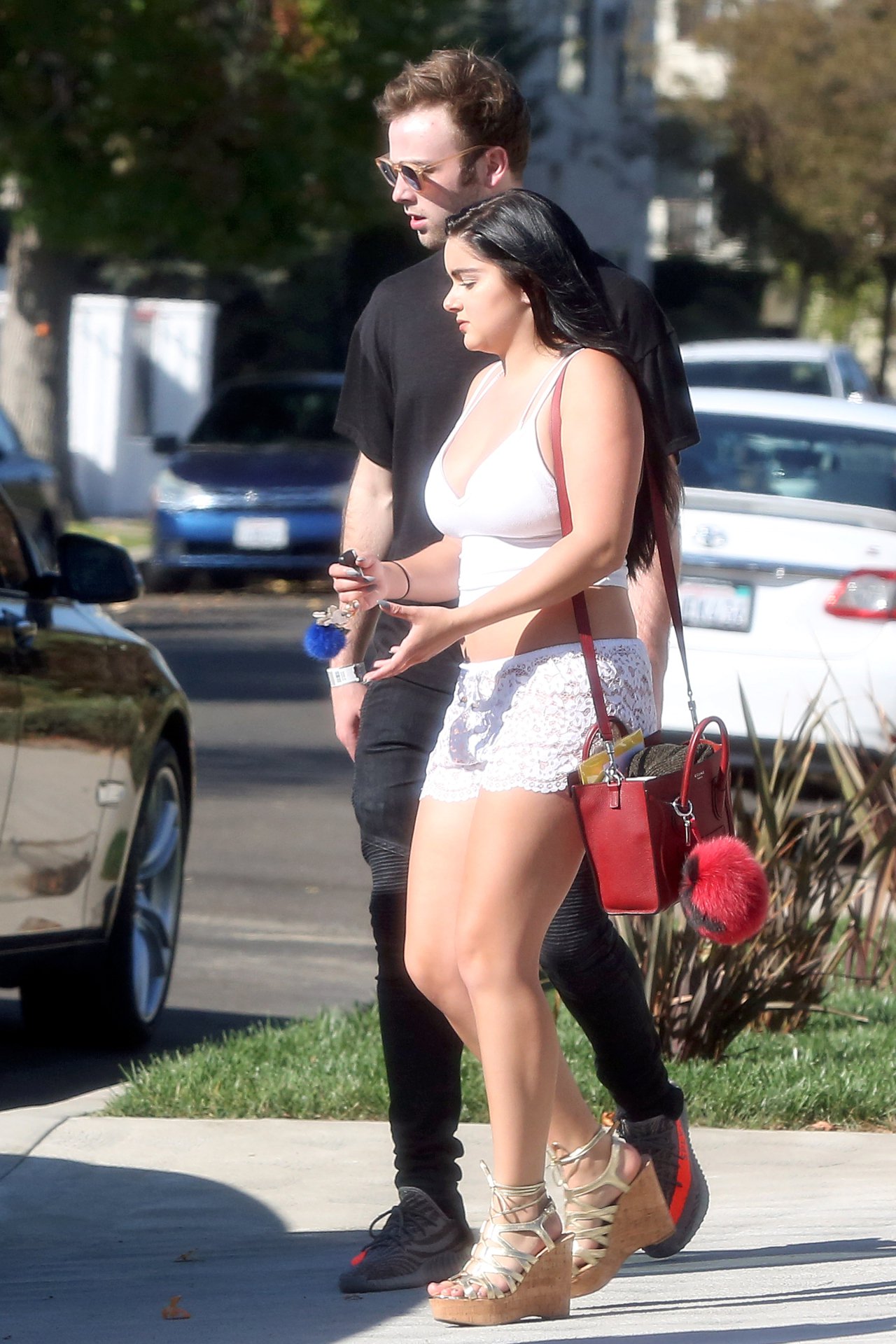 Ariel Winter in a white tank top and denim shorts out 